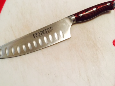 The 8-inch crimson straight handle chef knife from Ergo Chef. 